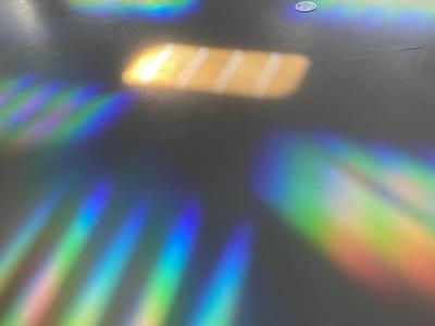 Prism and light reflections on concrete